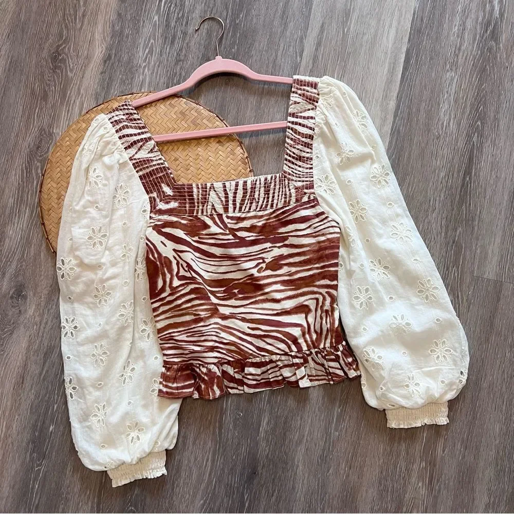 Anthropologie love the‎ label zebra laser cut puff sleeve smocked blouse
